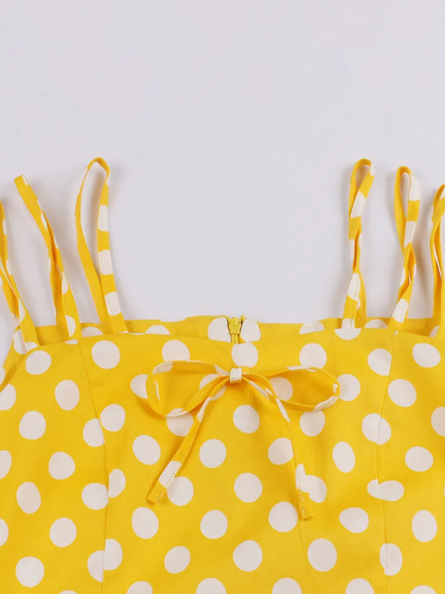Robe midi vintage à pois bretelles doubles nœud sur le devant coupe trapèze jaune