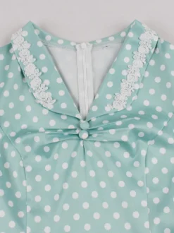 Robe mi-longue vintage à pois col à revers manches courtes col en dentelle ceinture décorative style rétro.