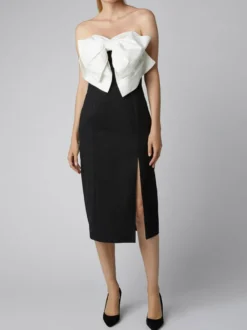 Robe noire chic à bretelles dos nu et sans manches ornée de nœuds idéale pour une soirée romantique.