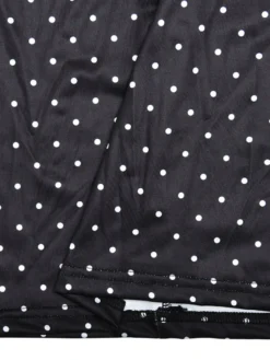 Robe noire cintrée et élégante à pois parfaite pour les sorties décontractées.