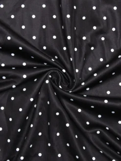 Robe noire cintrée et élégante à pois parfaite pour les sorties décontractées.