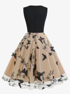 Robe rétro glamour années 50 noire bicolore à volants brodée sans manches col en V style rockabilly