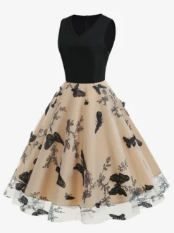 Robe rétro glamour années 50 noire bicolore à volants brodée sans manches col en V style rockabilly