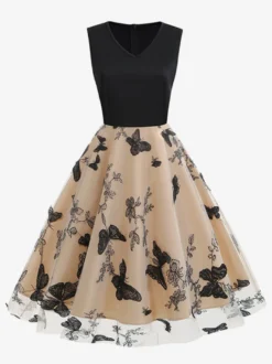 Robe rétro glamour années 50 noire bicolore à volants brodée sans manches col en V style rockabilly