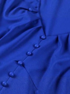 Robe rétro swing pour femme col en V froncée sur le devant boutons décoratifs manches papillon collection 2026