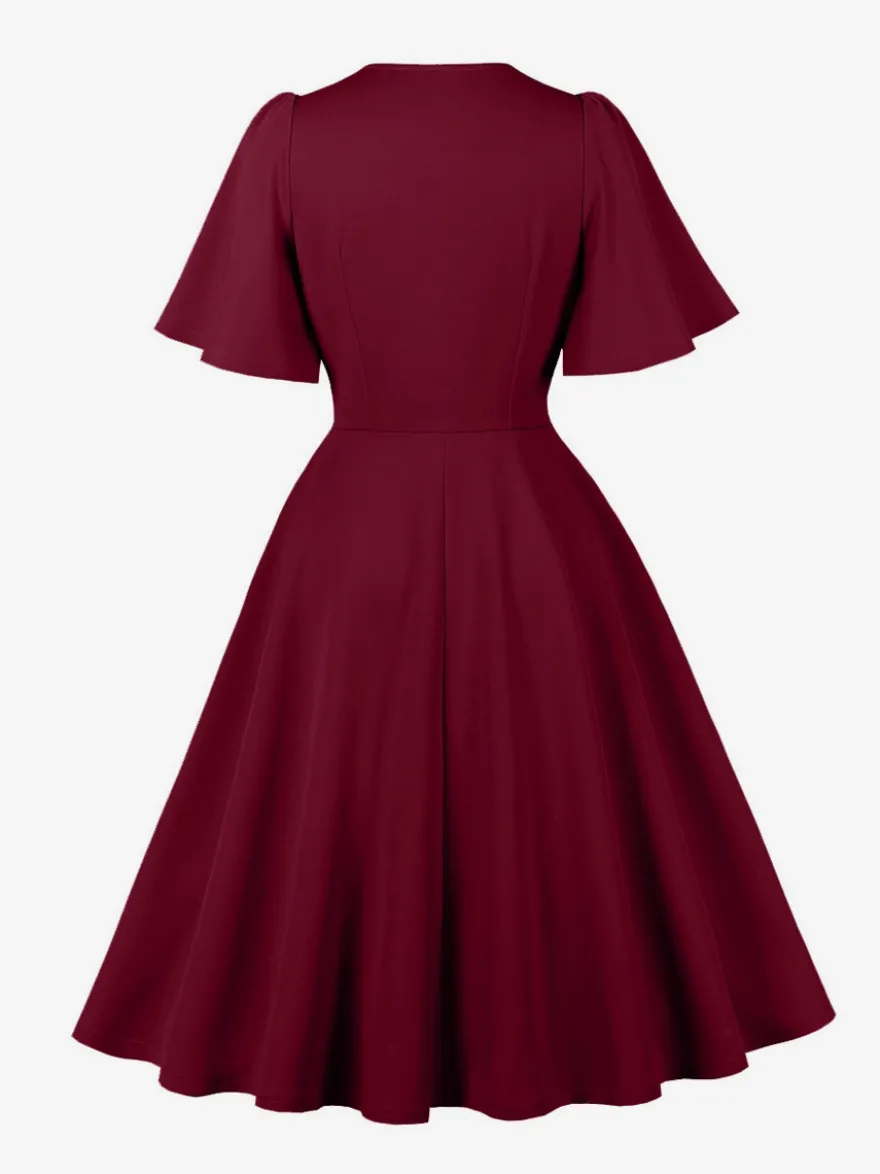 Robe rétro swing pour femme col en V froncée sur le devant boutons décoratifs manches papillon collection 2026