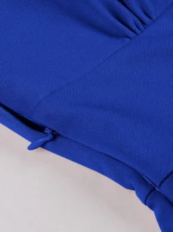 Robe rétro swing pour femme col en V froncée sur le devant boutons décoratifs manches papillon collection 2026