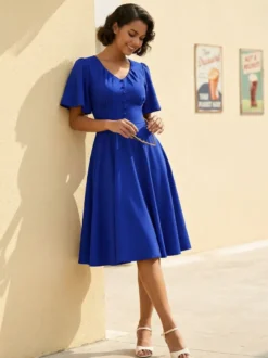 Robe rétro swing pour femme col en V froncée sur le devant boutons décoratifs manches papillon collection 2026