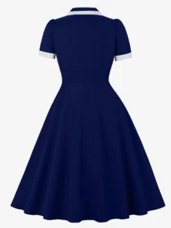 Robe rétro trapèze à col à revers contrasté et double poche pour femme (collection 2026)
