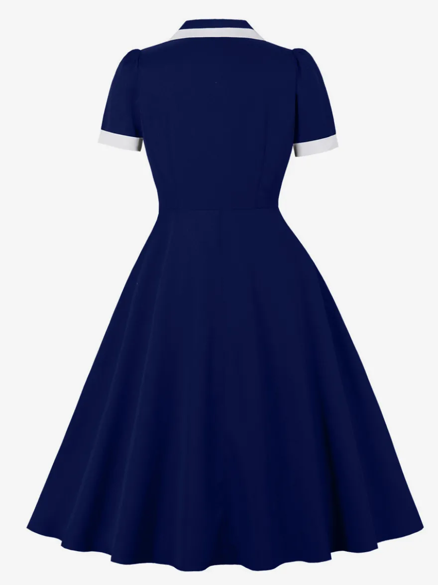Robe rétro trapèze à col à revers contrasté et double poche pour femme (collection 2026)