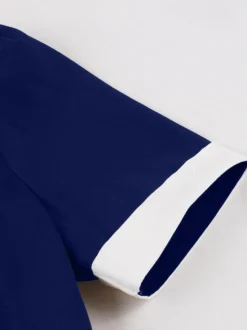 Robe rétro trapèze à col à revers contrasté et double poche pour femme (collection 2026)