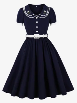 Robe trapèze à manches bouffantes col Peter Pan et broderies double épaisseur collection femme 2026