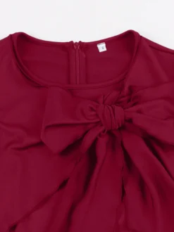 Robe trapèze à manches courtes et col rond ornée d'un nœud sur le côté collection femme 2026