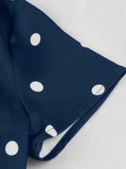 Robe vintage à pois revers manches courtes boutons sur le devant ceinture ajustable robe midi évasée style rétro