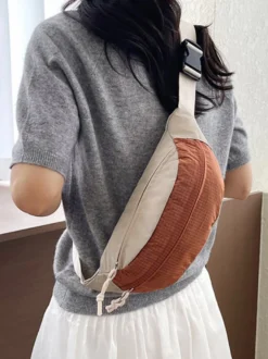 Sac banane léger en nylon color block bandoulière réglable idéal pour les voyages en extérieur.