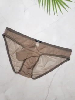 Slip transparent en maille fine pour homme taille basse avec poche éléphant respirant et sexy.