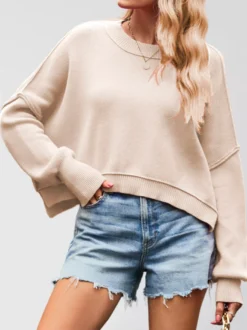 Sweat-shirt court à col rond et épaules tombantes pour femme couleur unie coupe ample manches longues style décontracté.