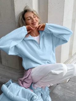 Sweat-shirt doux et duveteux à demi-zip coupe ample poignets côtelés manches longues idéal pour un look décontracté au quotidien.