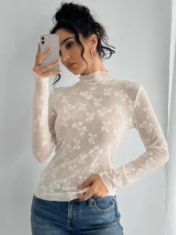 Top à manches longues en maille transparente avec nœud intégral jacquard pour femme 2026