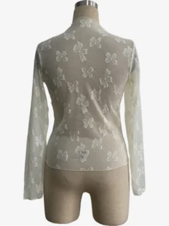 Top à manches longues en maille transparente avec nœud intégral jacquard pour femme 2026