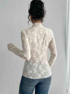 Top à manches longues en maille transparente avec nœud intégral jacquard pour femme 2026